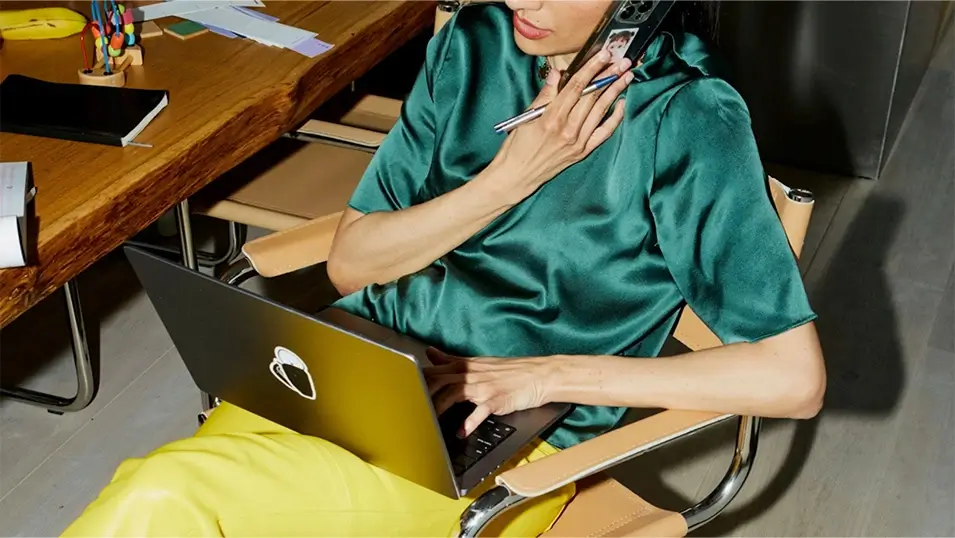 Modern social media management featuring a person working on a laptop while on a call
